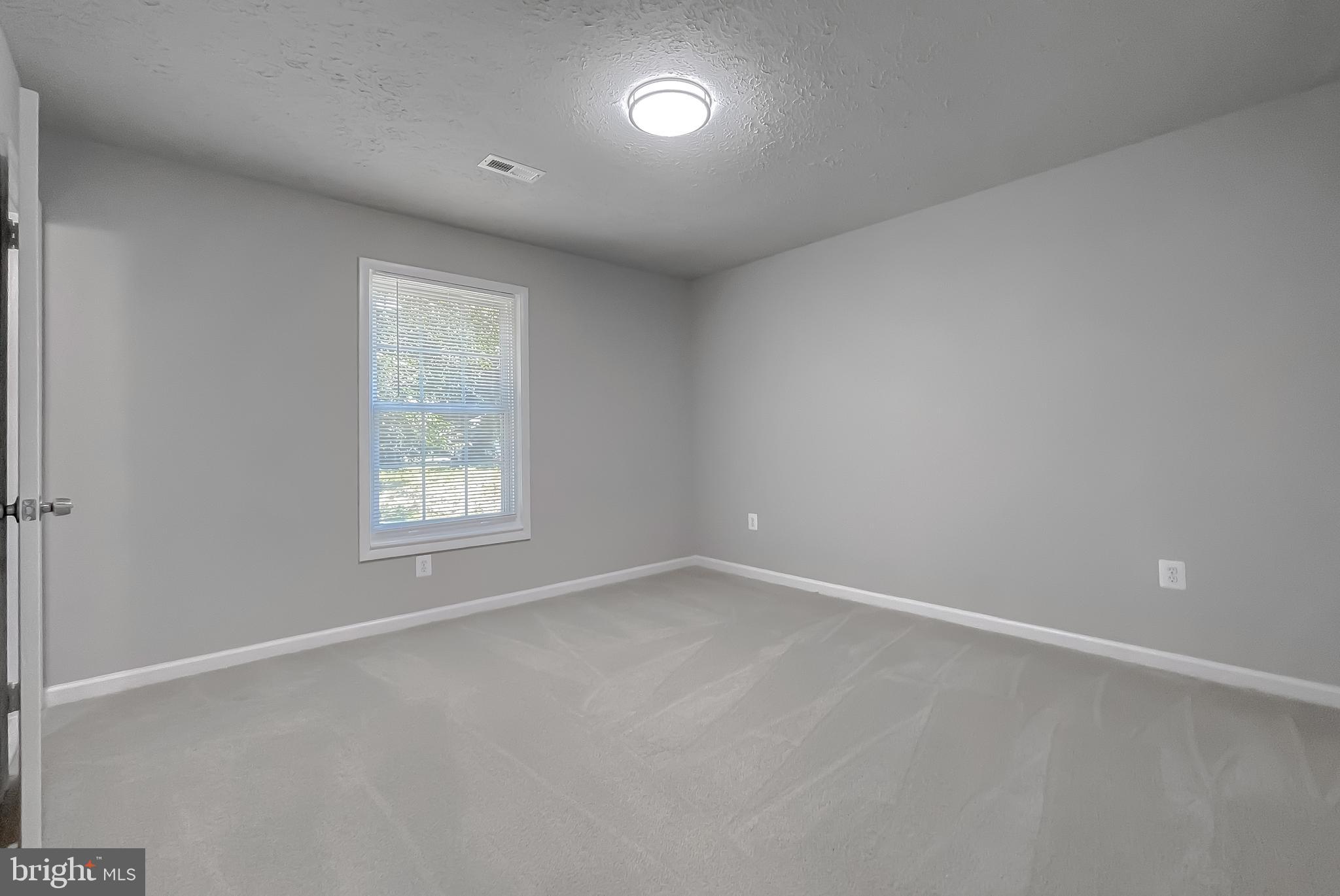 29810 Washington Road Mechanicsville, MD 20659 - Photo 29 of 44 an empty room with a window