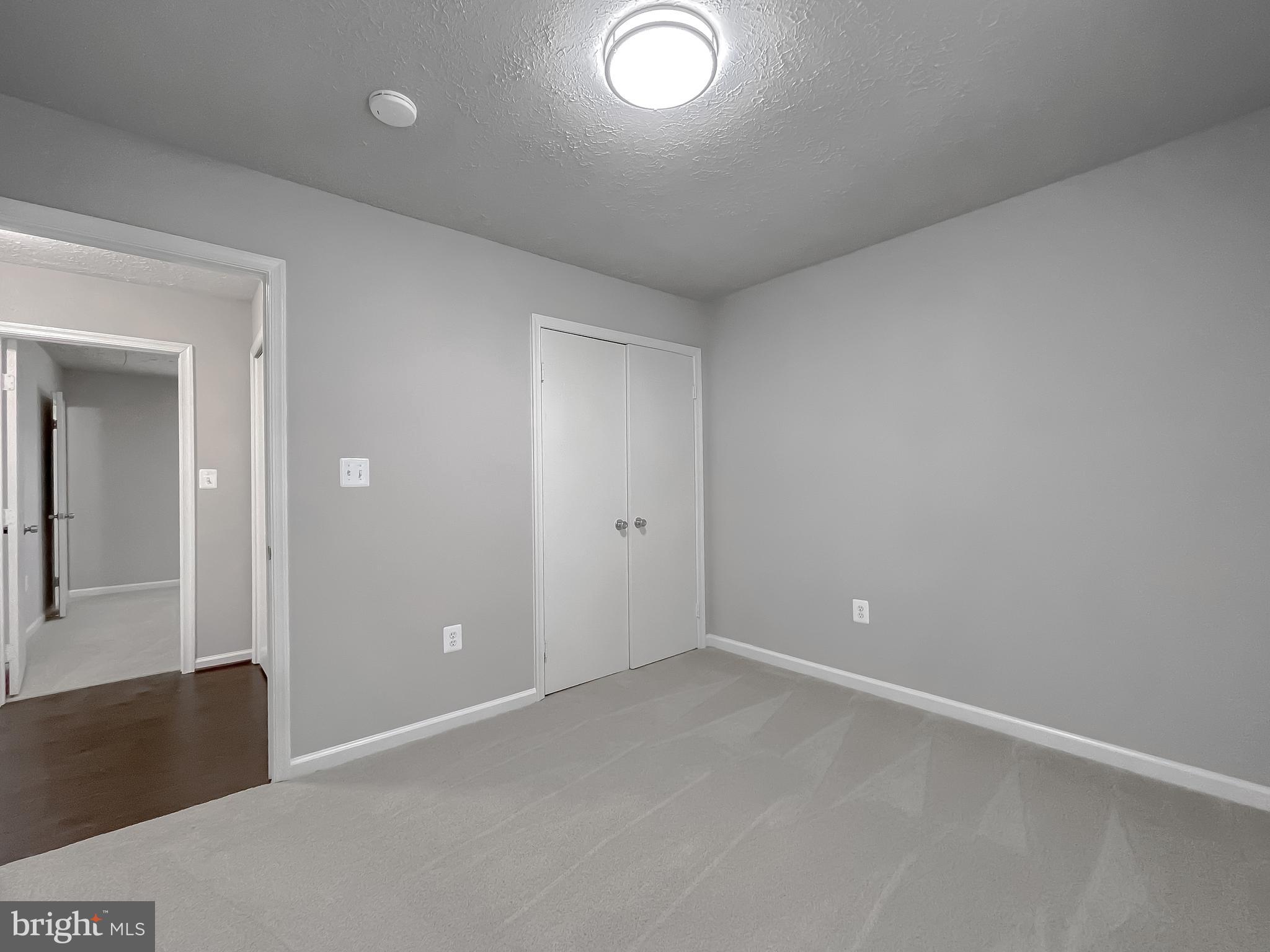 29810 Washington Road Mechanicsville, MD 20659 - Photo 32 of 44 wooden floor and glass door in a room