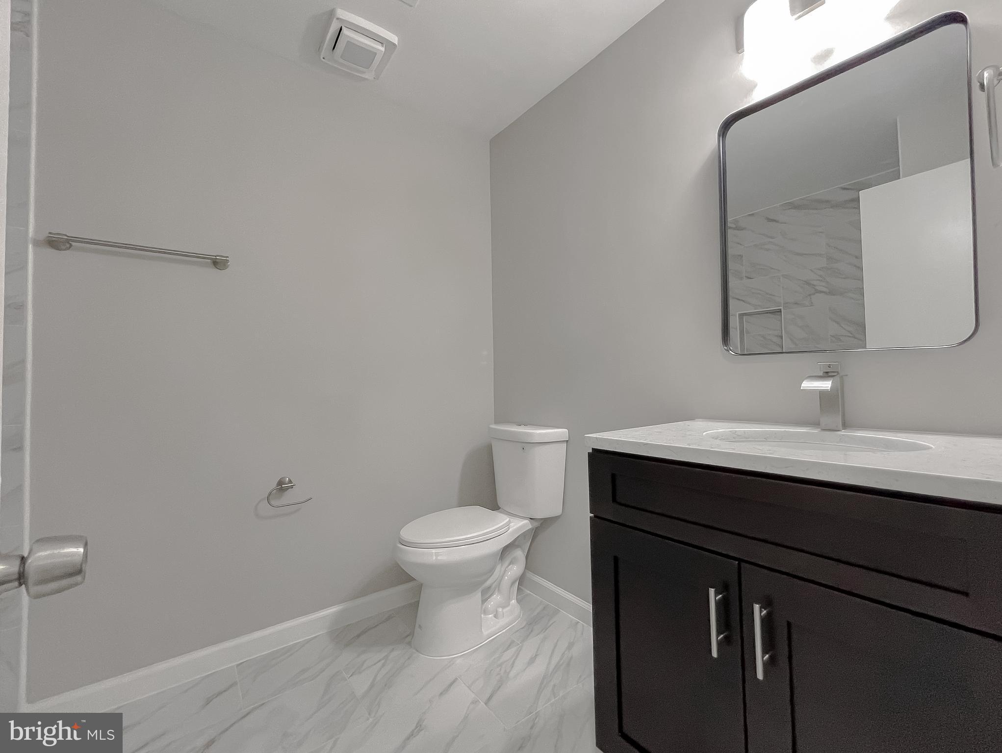 29810 Washington Road Mechanicsville, MD 20659 - Photo 34 of 44 a bathroom with a sink and a toilet