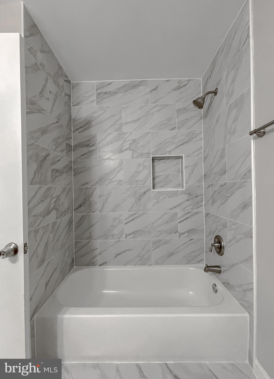 29810 Washington Road Mechanicsville, MD 20659 - Photo 35 of 44 a bathroom with a shower and a bath tub