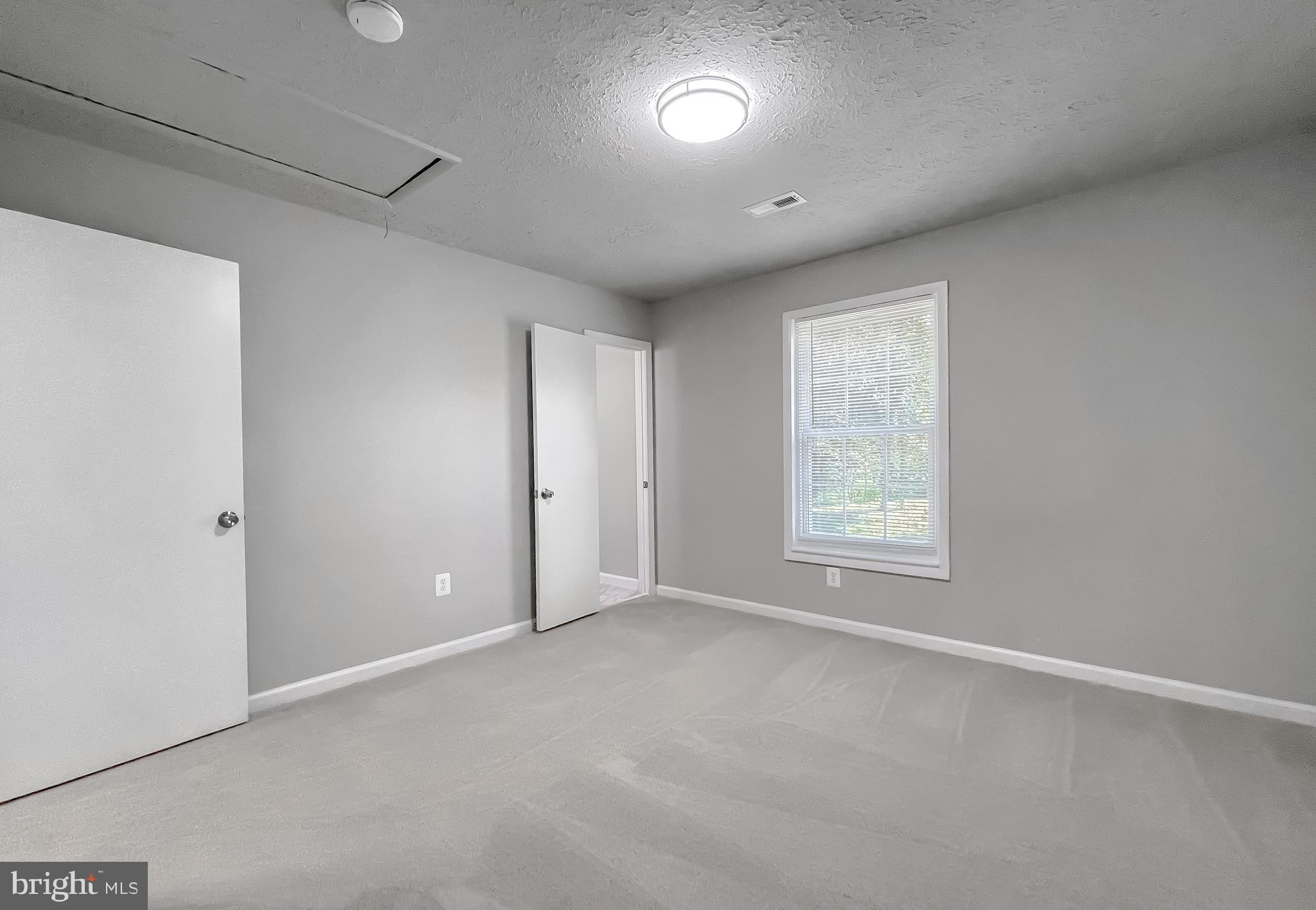 29810 Washington Road Mechanicsville, MD 20659 - Photo 38 of 44 a view of an empty room with a window