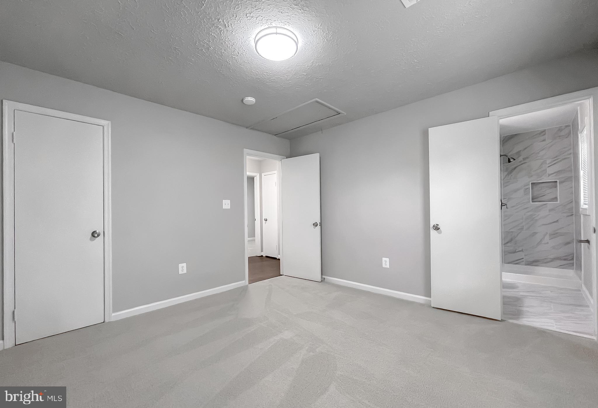 29810 Washington Road Mechanicsville, MD 20659 - Photo 39 of 44 an empty room with closet and windows