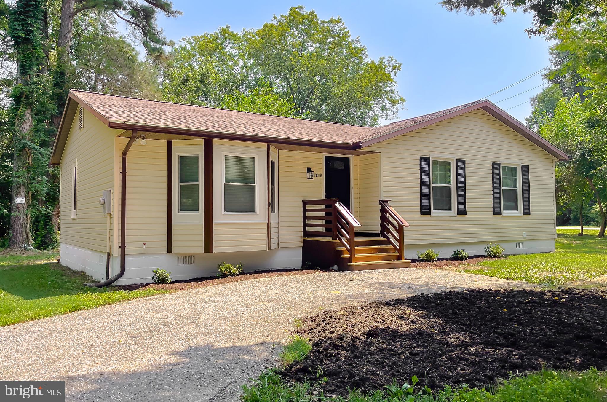29810 Washington Road Mechanicsville, MD 20659 - Photo 4 of 44 a view of a house with backyard and sitting area