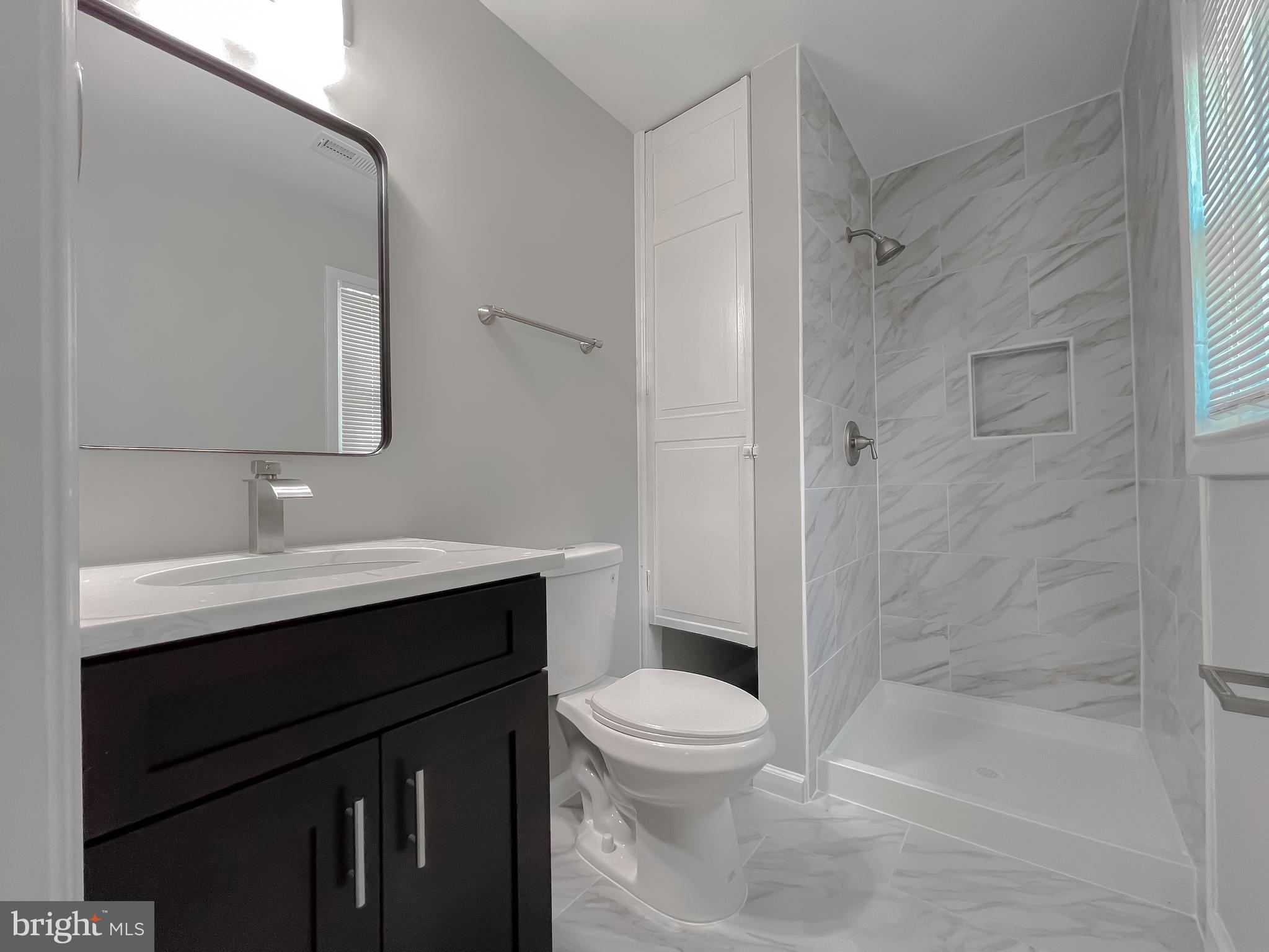 29810 Washington Road Mechanicsville, MD 20659 - Photo 44 of 44 a bathroom with a sink a toilet and shower