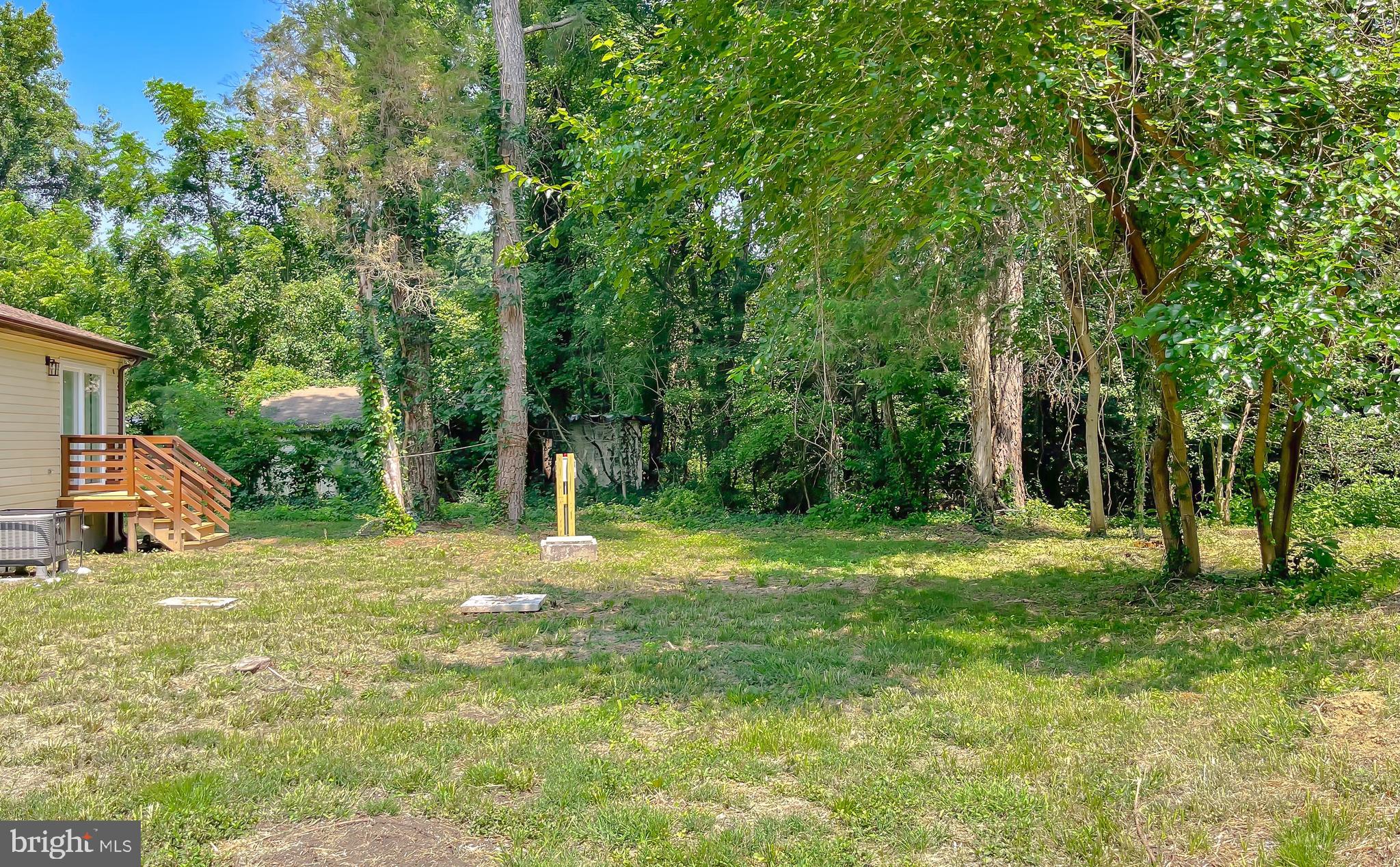 29810 Washington Road Mechanicsville, MD 20659 - Photo 8 of 44 a backyard of a house with table and chairs