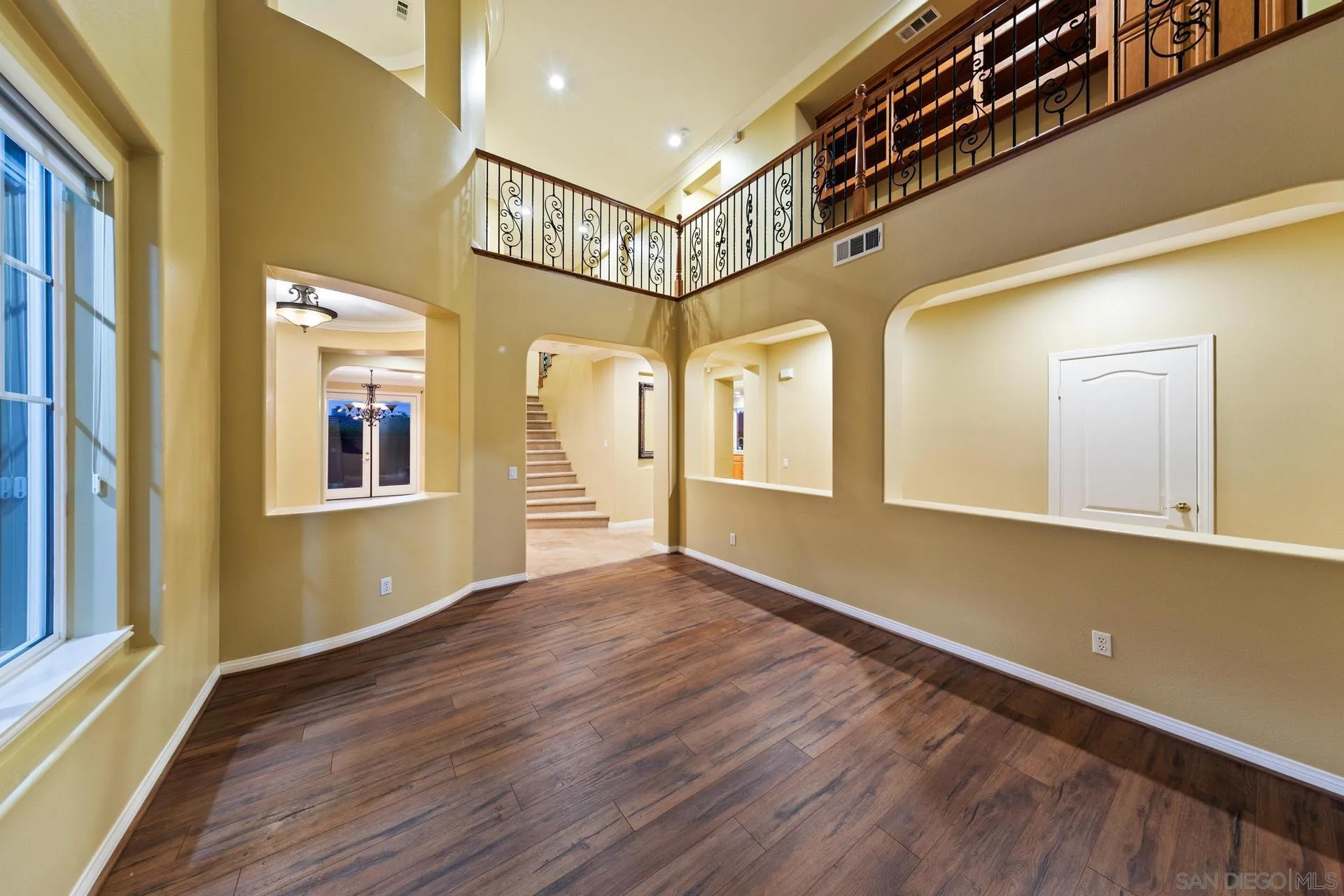 624 Ridgemont Circle Escondido, CA 92027 - Photo 12 of 71 a view of a hallway with wooden floor and staircase