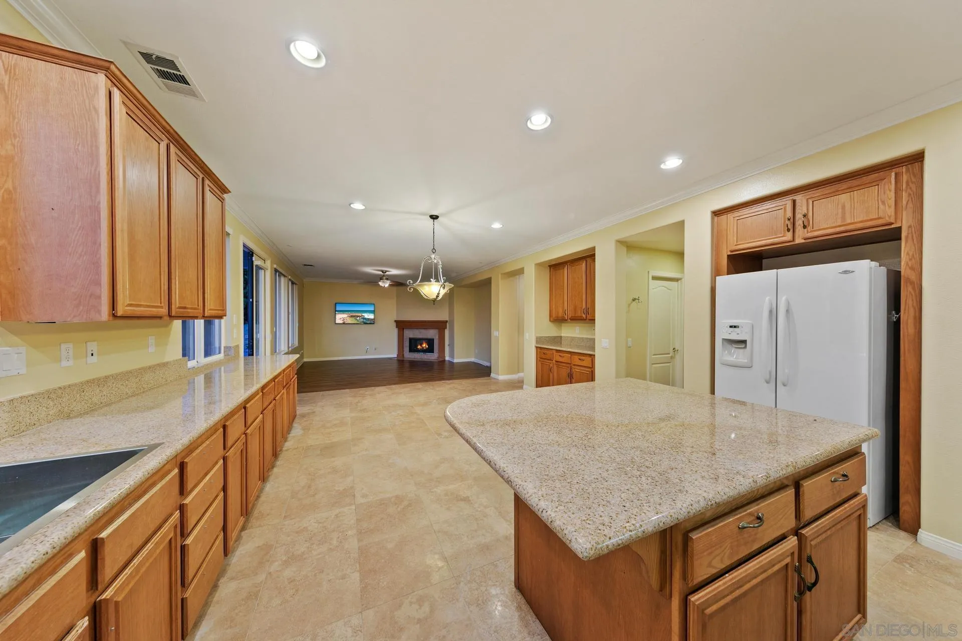 624 Ridgemont Circle Escondido, CA 92027 - Photo 22 of 71 a large kitchen with kitchen island a sink appliances and cabinets