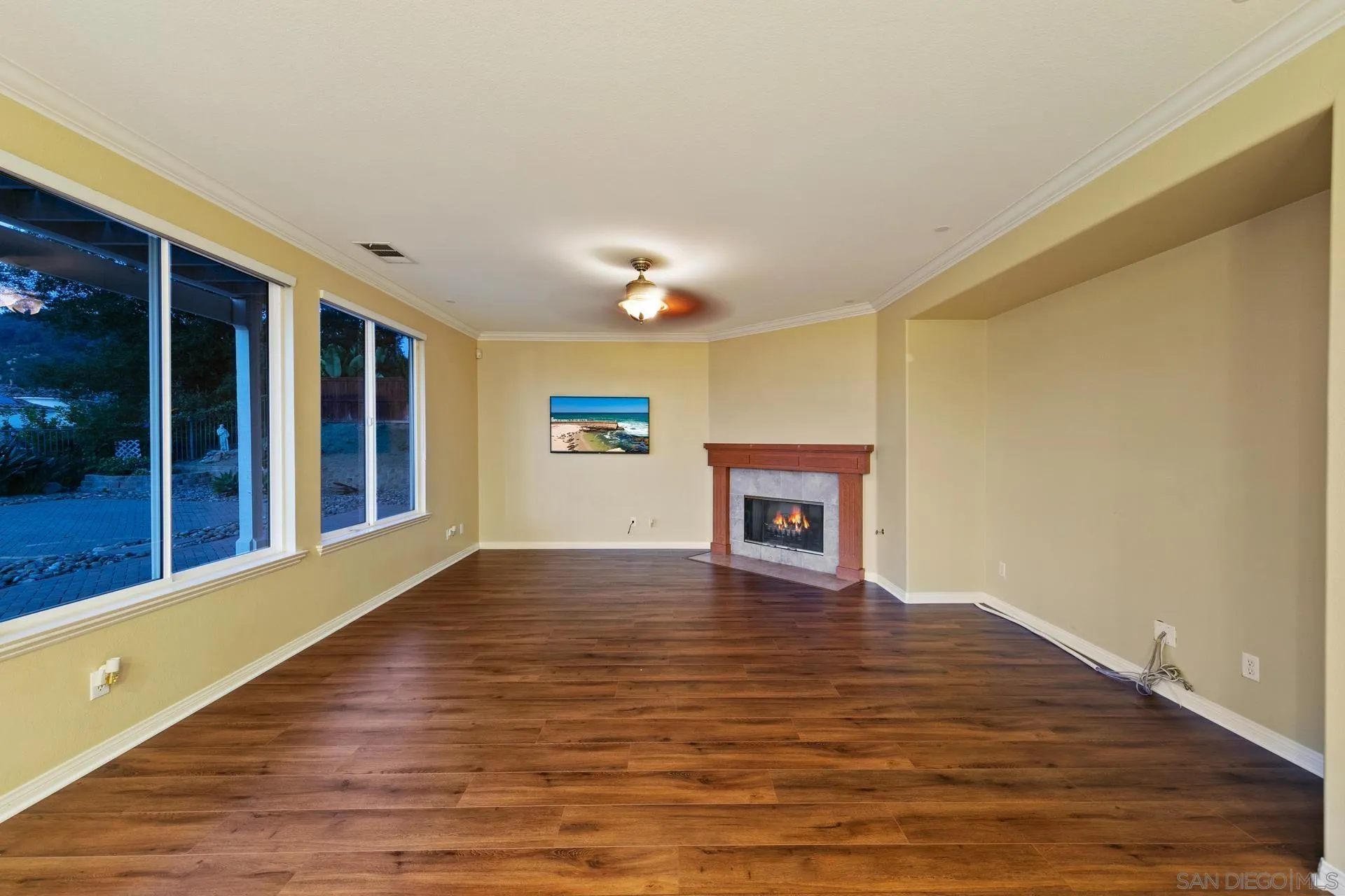 624 Ridgemont Circle Escondido, CA 92027 - Photo 26 of 71 a view of an empty room with wooden floor and a window