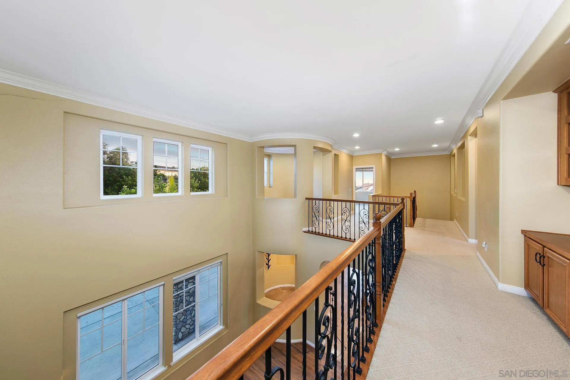 624 Ridgemont Circle Escondido, CA 92027 - Photo 27 of 71 a view of a hallway with wooden floor and stairs