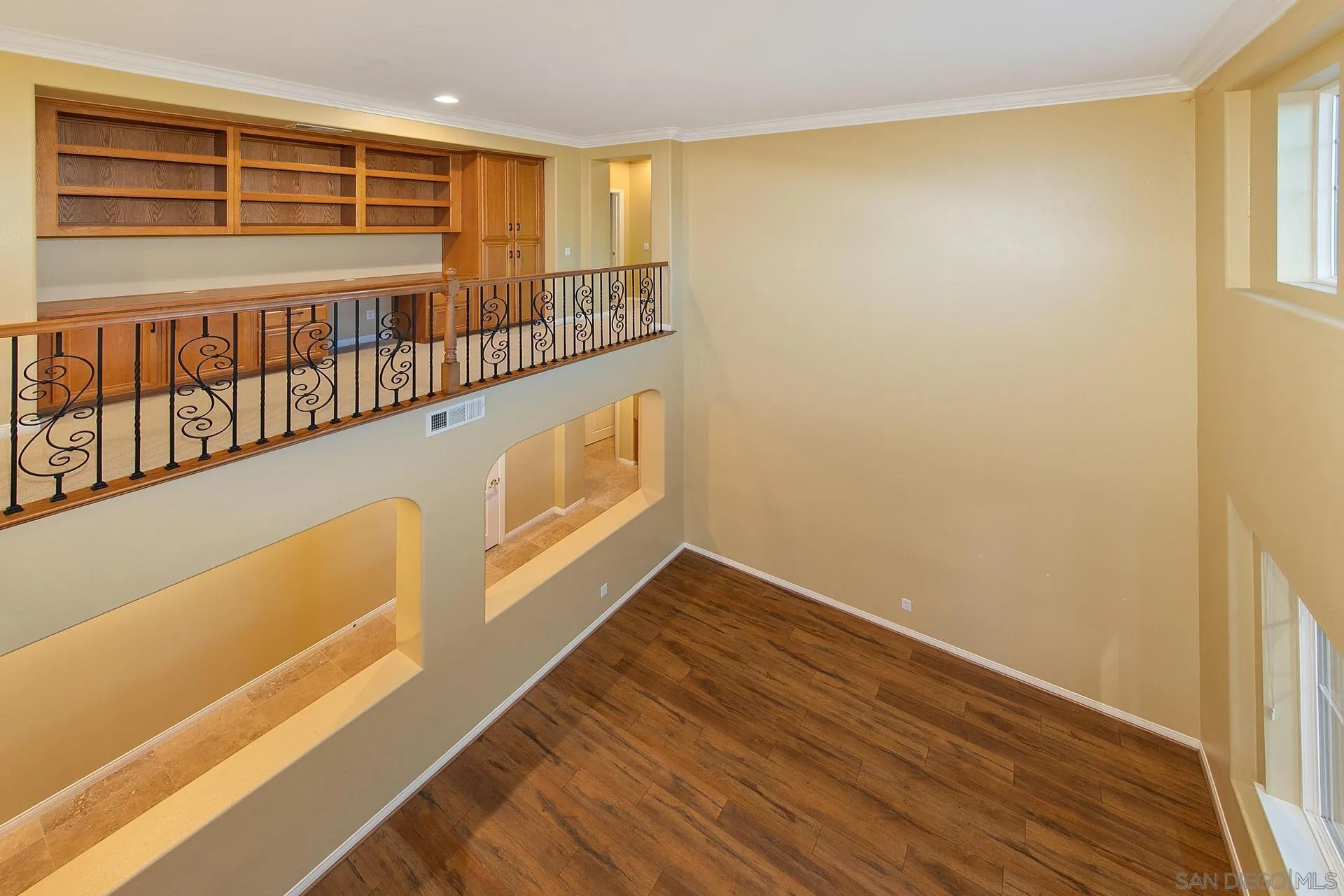 624 Ridgemont Circle Escondido, CA 92027 - Photo 29 of 71 a view of an empty room with wooden floor and a window