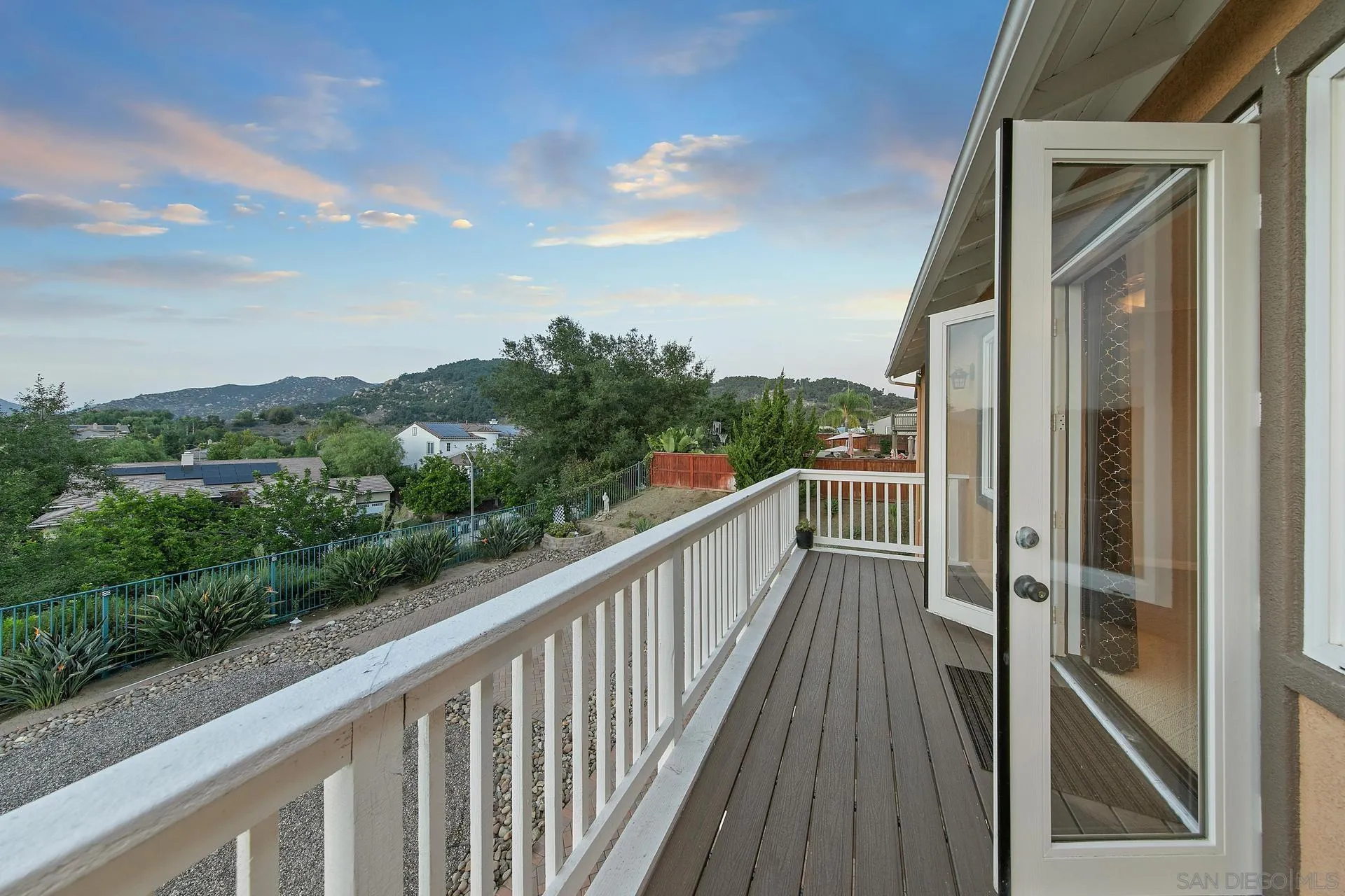 624 Ridgemont Circle Escondido, CA 92027 - Photo 36 of 71 a view of a balcony with wooden floor and fence