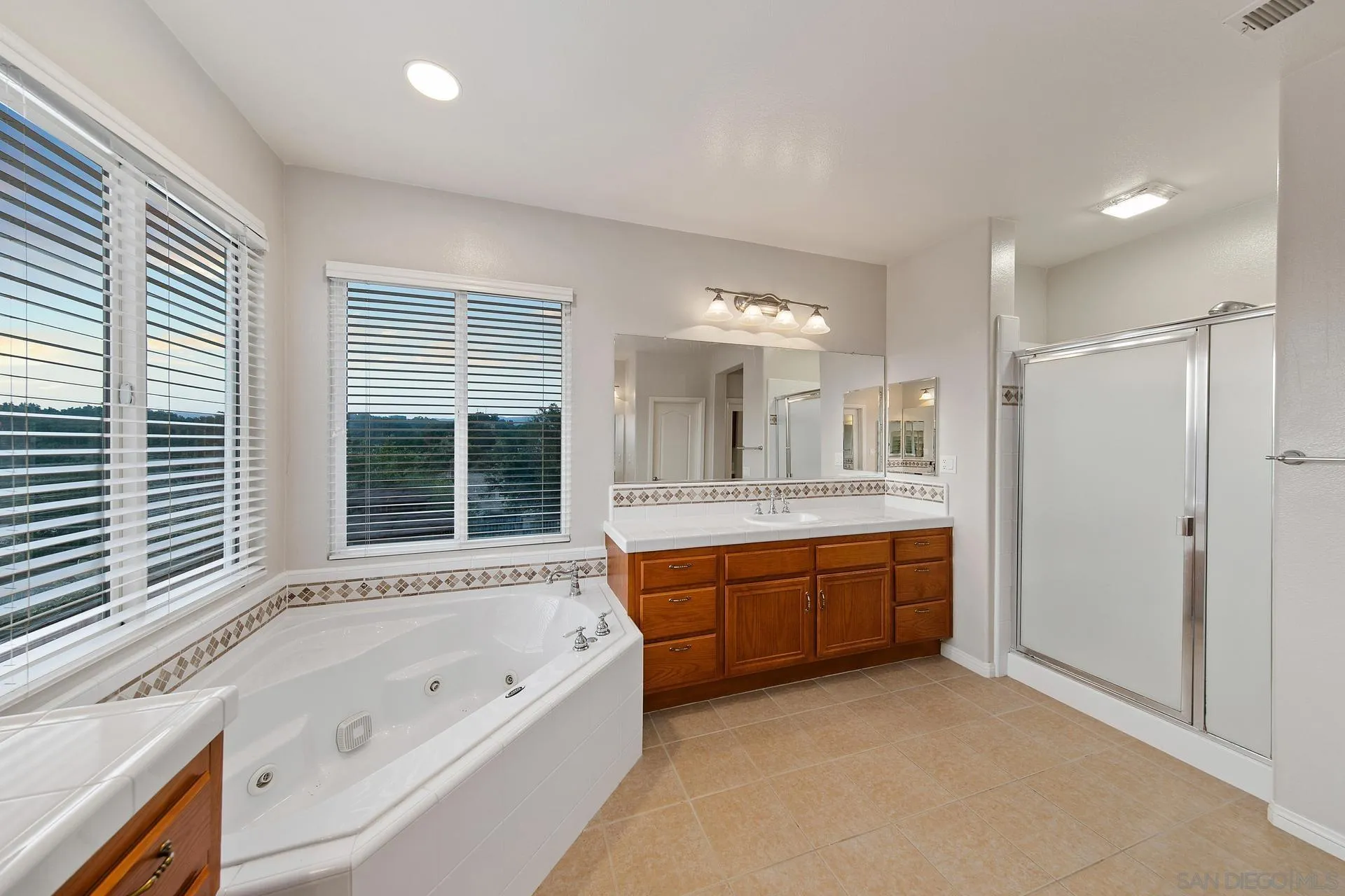 624 Ridgemont Circle Escondido, CA 92027 - Photo 39 of 71 a large spacious bathroom with a large tub shower and sink