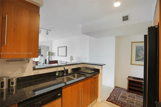 a living room with furniture a flat screen tv and large window
