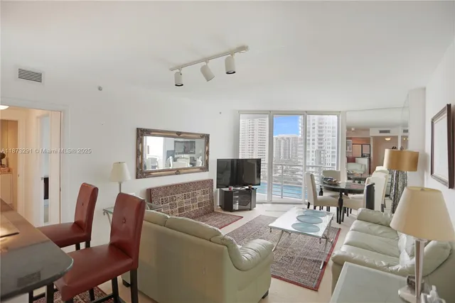 a kitchen with stainless steel appliances a refrigerator and a stove top oven