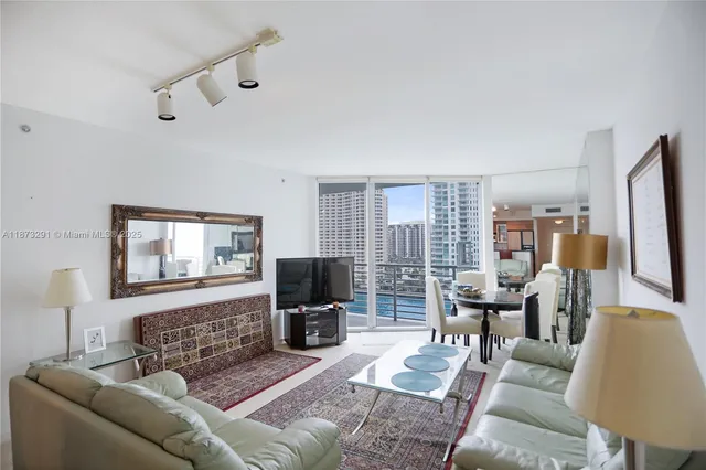a bathroom with a sink toilet double vanity and shower