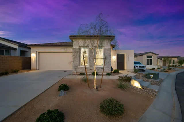 a view of a swimming pool with an outdoor space and seating area