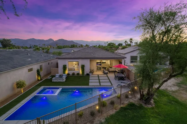 a view of balcony with two chairs and a table