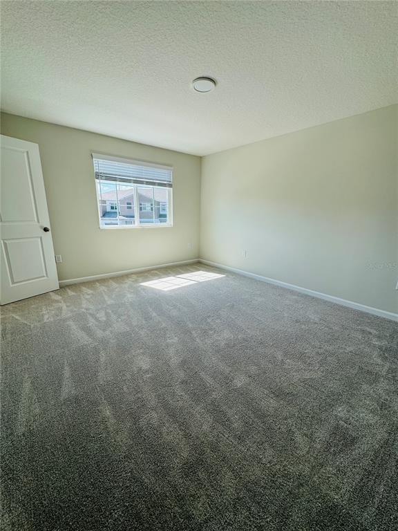 4906 Livingston Lane Oviedo, FL 32765 - Photo 16 of 25 an empty room with windows