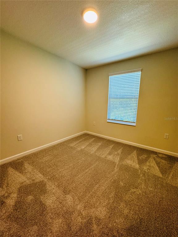 4906 Livingston Lane Oviedo, FL 32765 - Photo 22 of 25 an empty room and a window