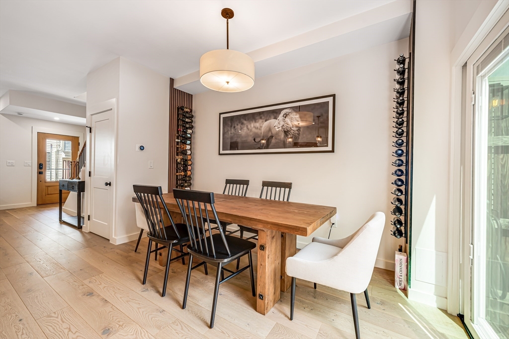 18 Loring Street Boston, MA 02127 - Photo 11 of 27 a view of a dining room with furniture and wooden floor