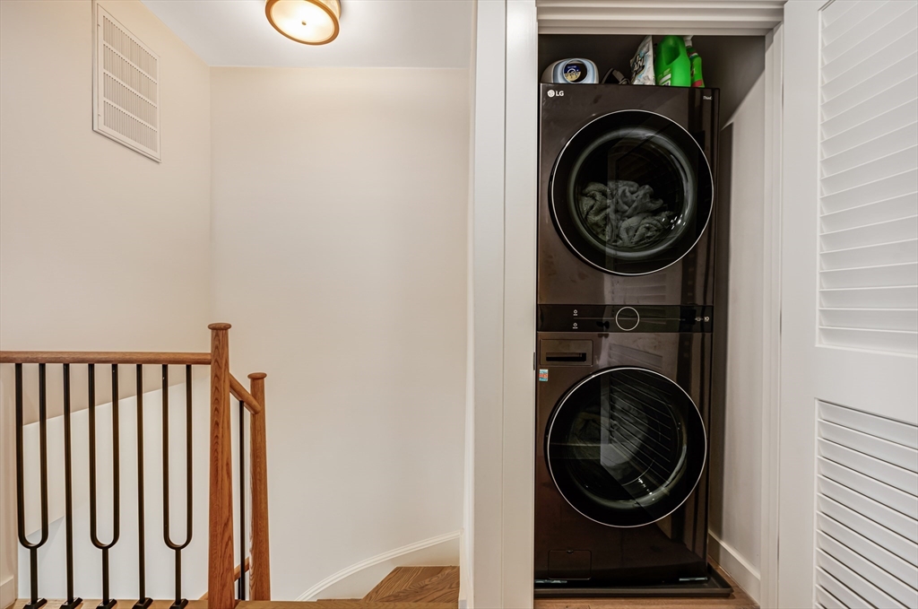 18 Loring Street Boston, MA 02127 - Photo 12 of 27 a view of a hallway with washer and dryer