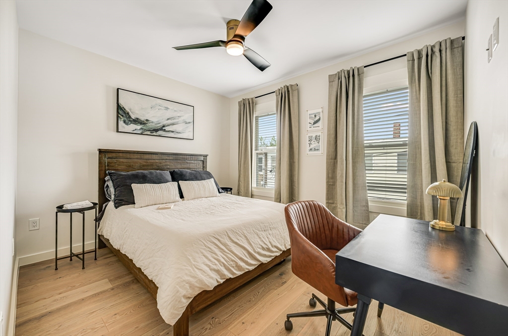 18 Loring Street Boston, MA 02127 - Photo 17 of 27 a bedroom with a bed and a desk