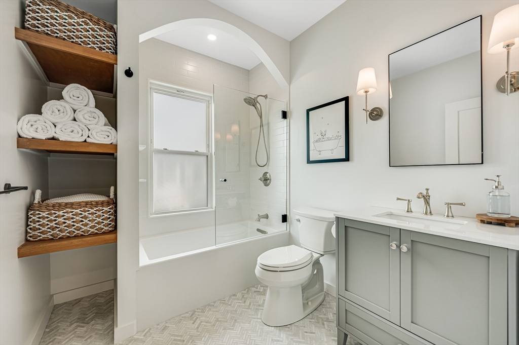 18 Loring Street Boston, MA 02127 - Photo 18 of 27 a bathroom with a sink a toilet and shower