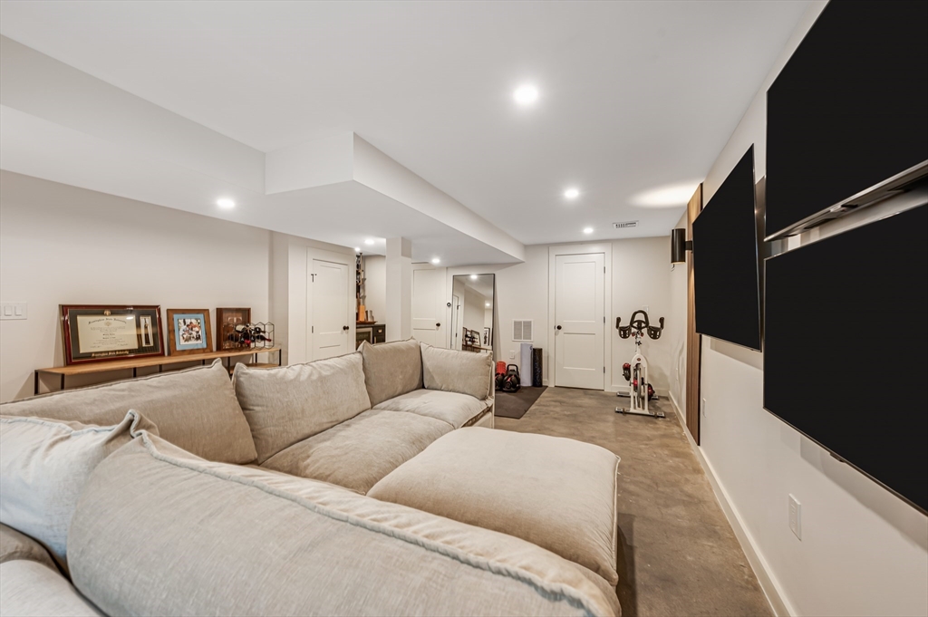 18 Loring Street Boston, MA 02127 - Photo 21 of 27 a living room with furniture and a flat screen tv