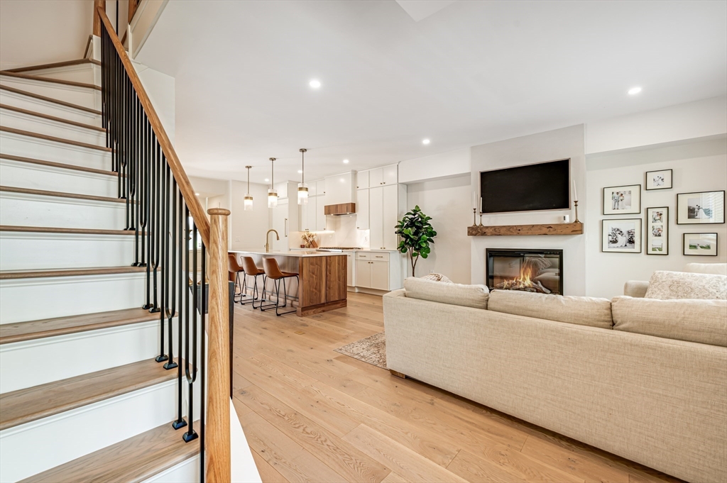 18 Loring Street Boston, MA 02127 - Photo 6 of 27 a living room with furniture a flat screen tv and a fireplace