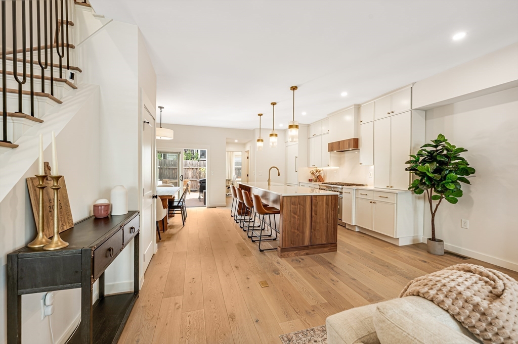 18 Loring Street Boston, MA 02127 - Photo 7 of 27 a living room with furniture kitchen view and a large window