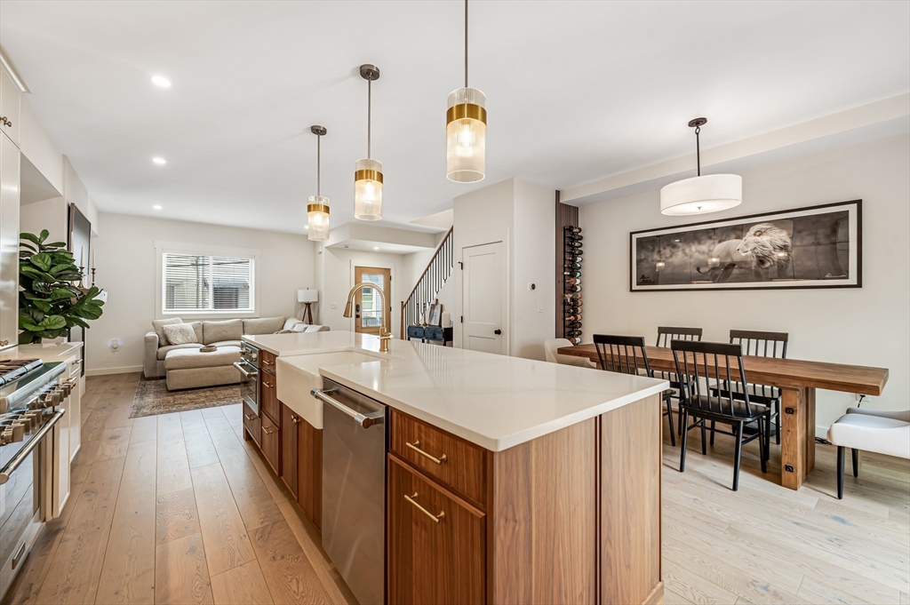 18 Loring Street Boston, MA 02127 - Photo 9 of 27 a large kitchen with a table chairs and flat screen tv
