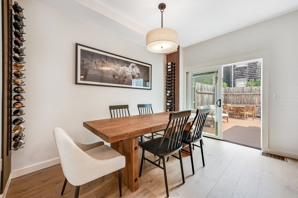 18 Loring Street Boston, MA 02127 - Photo 10 of 27 a view of a dining room with furniture window and wooden floor