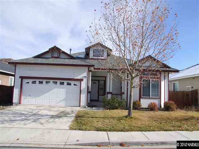 7448 Celeste Drive Reno, NV 89511 - Photo 1 of 3 a front view of a house with garden