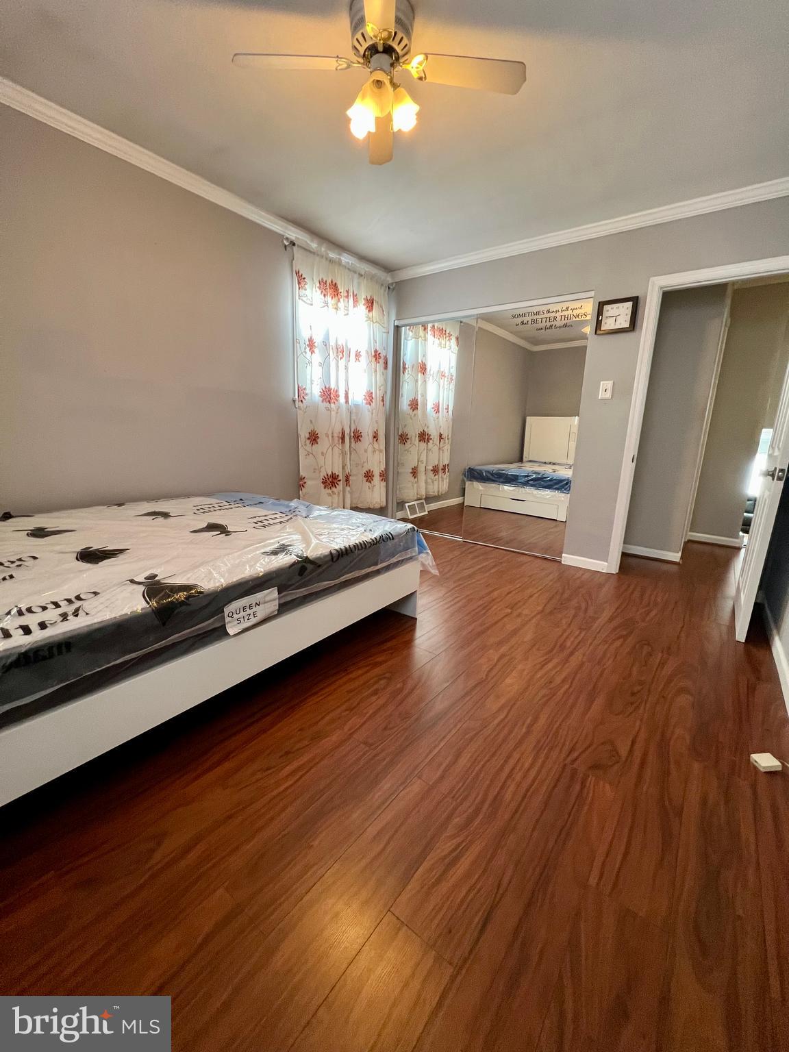 2988 Welsh Road Philadelphia, PA 19152 - Photo 32 of 38 a spacious bedroom with a bed and a chandelier