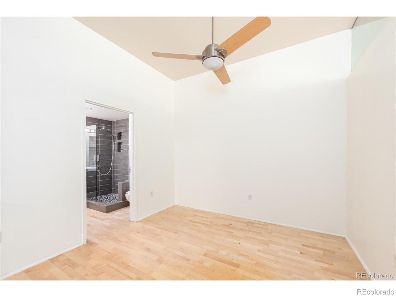 3100 Huron Street, Unit 3P Denver, CO 80202 - Photo 21 of 34 a view of empty room with wooden floor