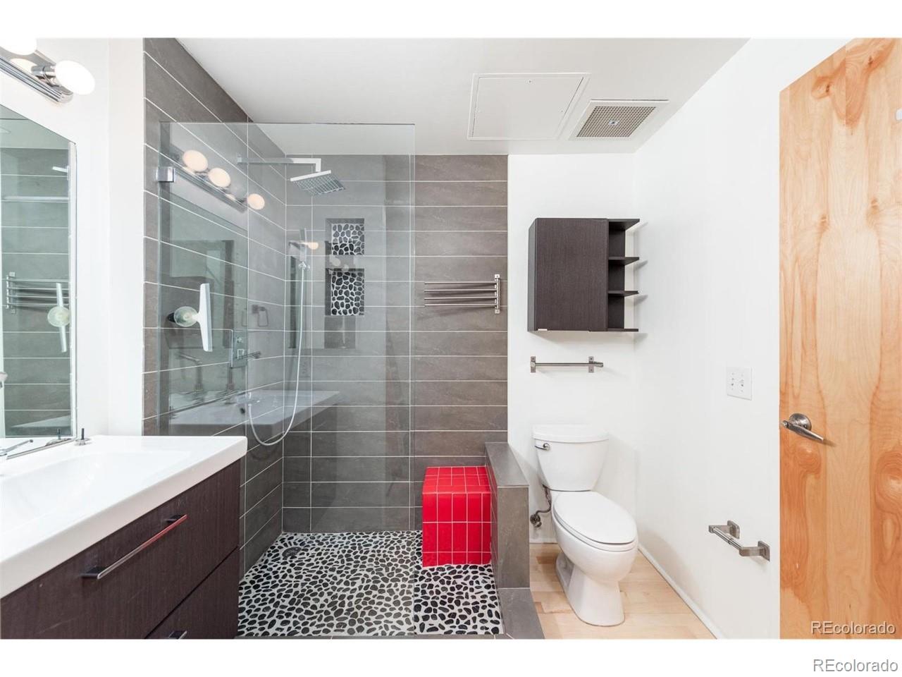 3100 Huron Street, Unit 3P Denver, CO 80202 - Photo 23 of 34 a bathroom with a sink a toilet and shower