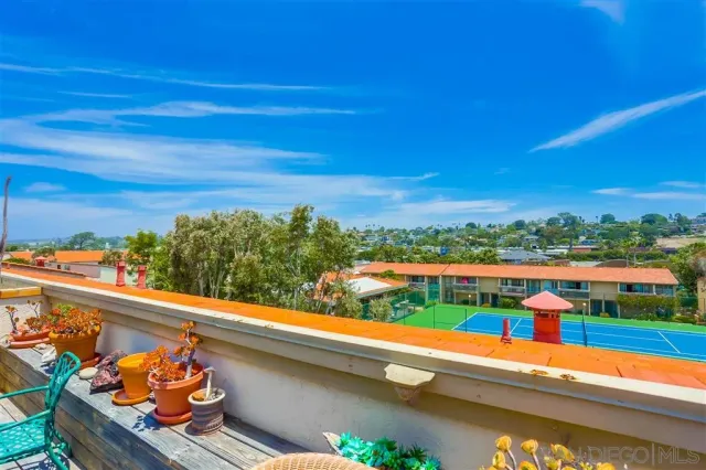 a view of roof deck with furniture