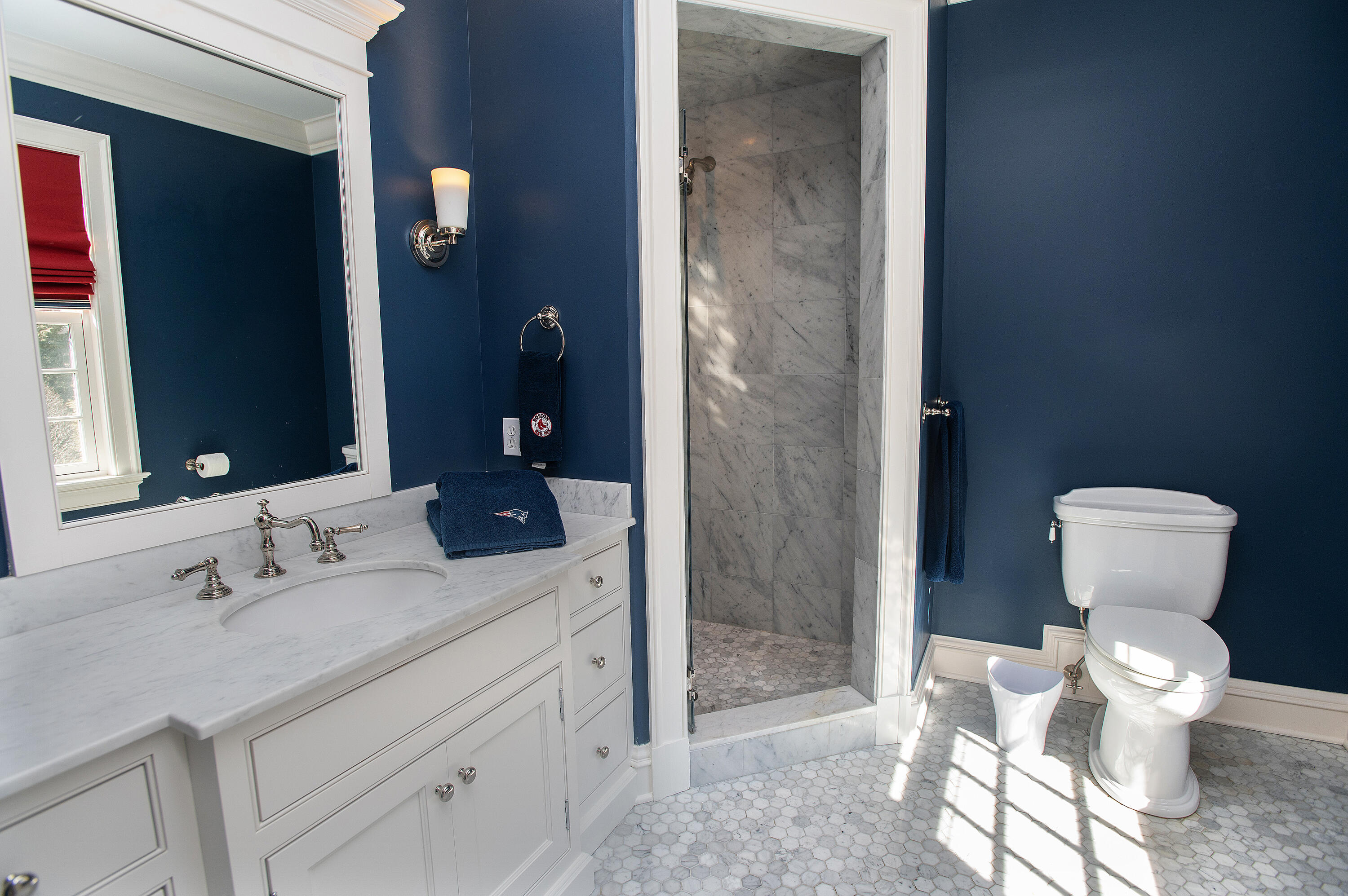 560 Ponus Ridge Road New Canaan, CT 06840 - Photo 36 of 67 a bathroom with a sink toilet and shower
