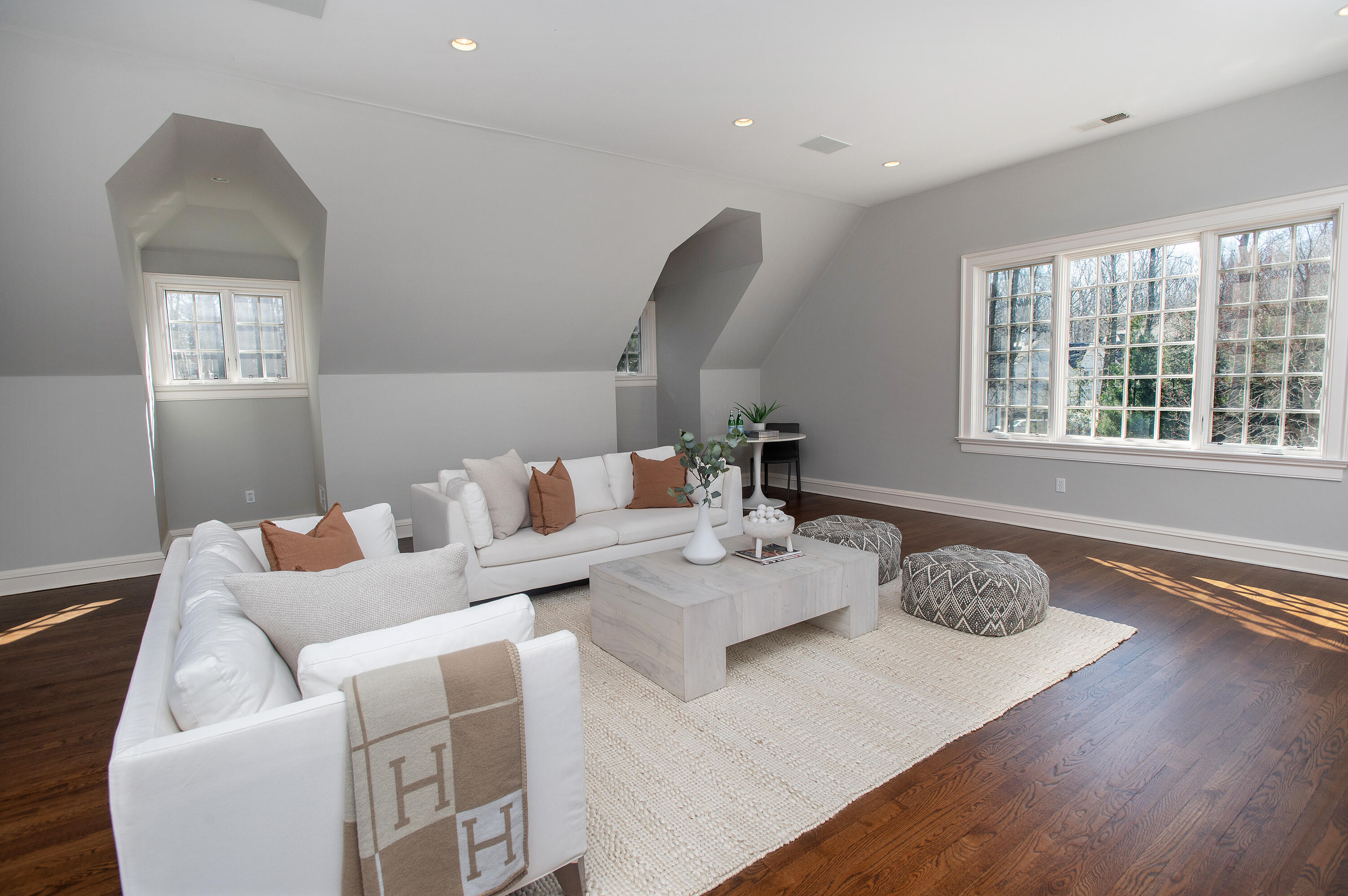 560 Ponus Ridge Road New Canaan, CT 06840 - Photo 42 of 67 a living room with furniture and a window