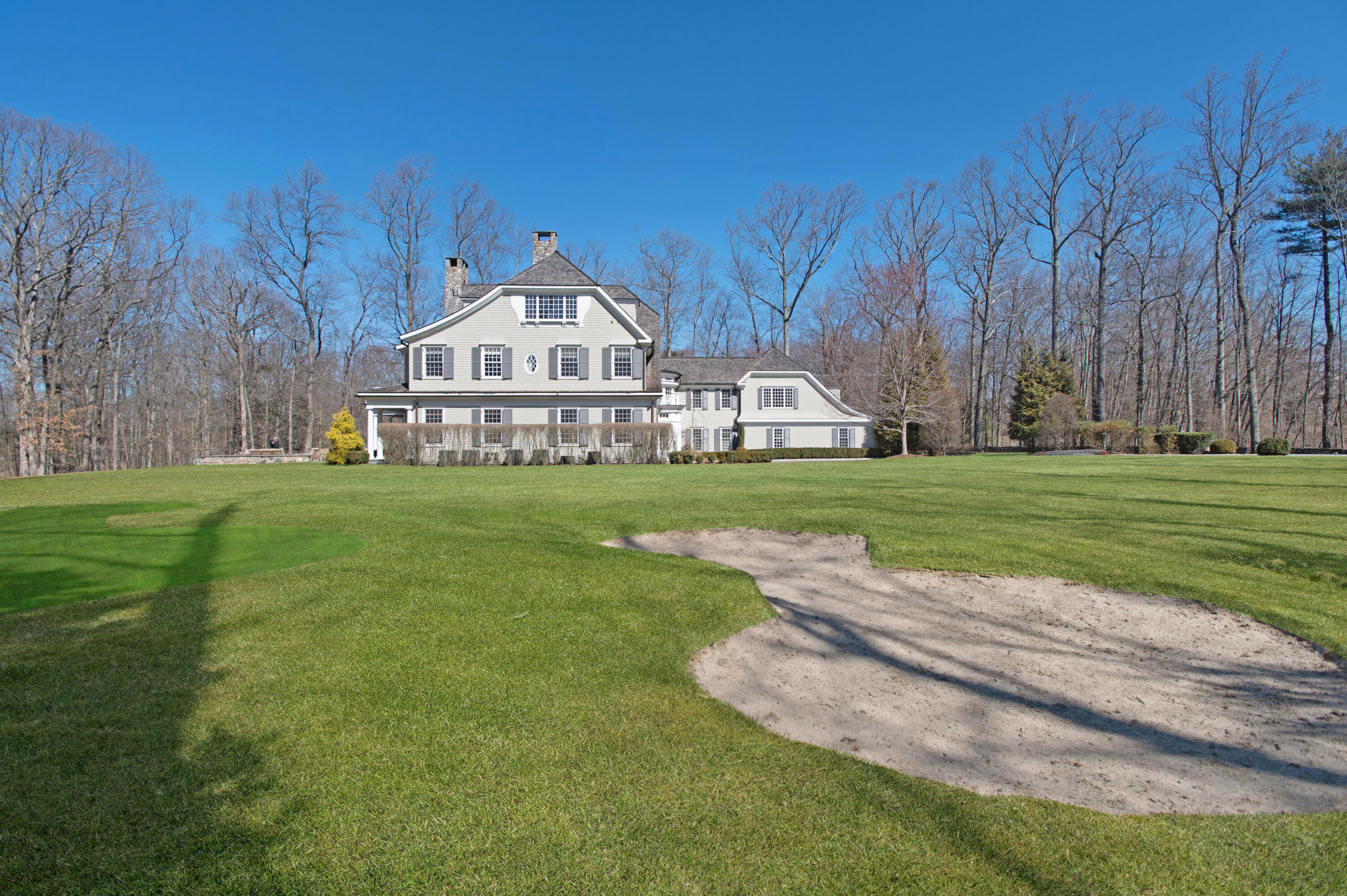 560 Ponus Ridge Road New Canaan, CT 06840 - Photo 66 of 67 a view of a house with a big yard