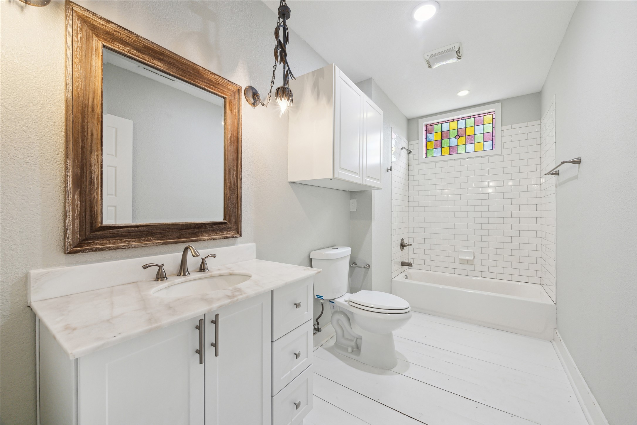 613 9th Street Galveston, TX 77550 - Photo 23 of 35 a bathroom with a sink a toilet a mirror and shower