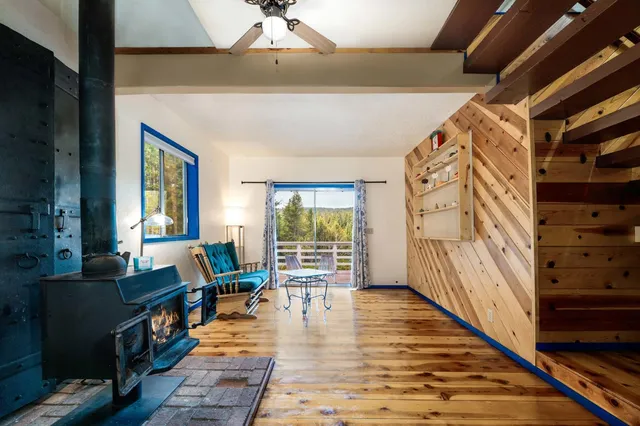 a view of a livingroom with furniture and a fireplace