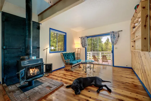 a view of balcony with wooden floor and fence