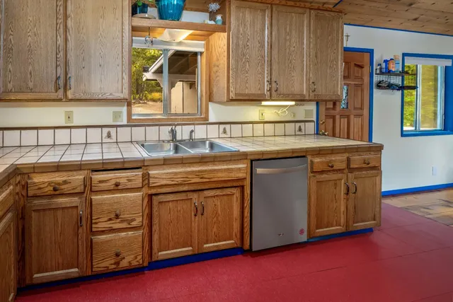 a view of a hallway with closet and wooden floor