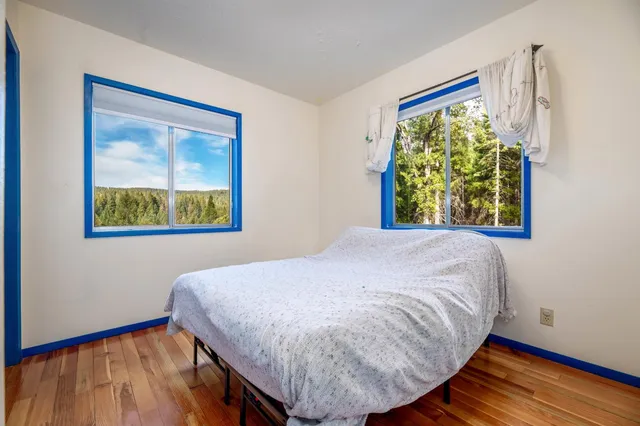a view of a house with a yard and roof