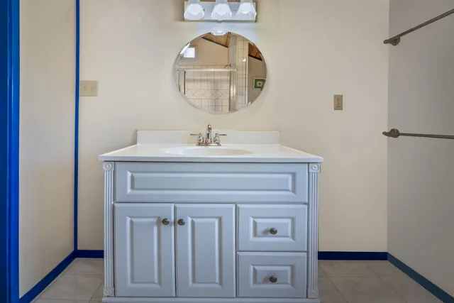 a white bath tub sitting next to a toilet