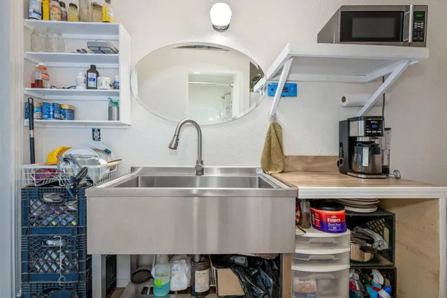a backyard of a house with wooden floor and fence