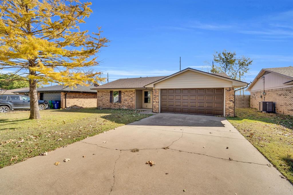 221 North Edgefield Road Waxahachie, TX 75165 - Photo 27 of 27 a front view of a house with a yard and garage