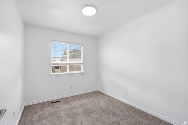 793 North 150 E Street Springville, UT 84663 - Photo 17 of 26 Neutral white walls with a single window featuring horizontal blinds