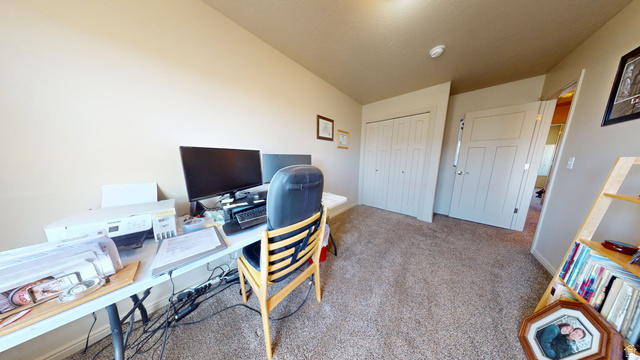 1674 Eastridge Road Price, UT 84501 - Photo 23 of 34 Carpeted room with neutral wall paint and white trim